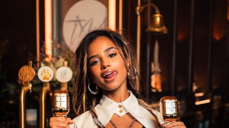Tyla portrait photo highlighting her music career and achievements